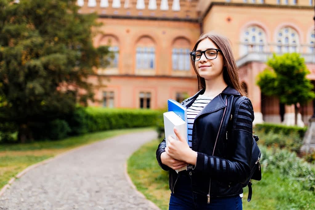 College Student Holding Books College Student Holding Books